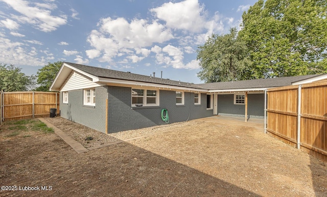 3410 53rd St, Lubbock, TX 79413 - rear view of house featuring brick siding and a fenced backyard