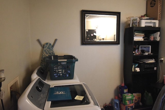 laundry room featuring separate washer and dryer