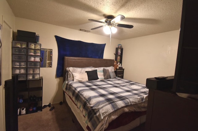 carpeted bedroom with ceiling fan and a textured ceiling