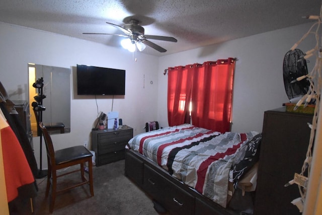 carpeted bedroom with ceiling fan and a textured ceiling