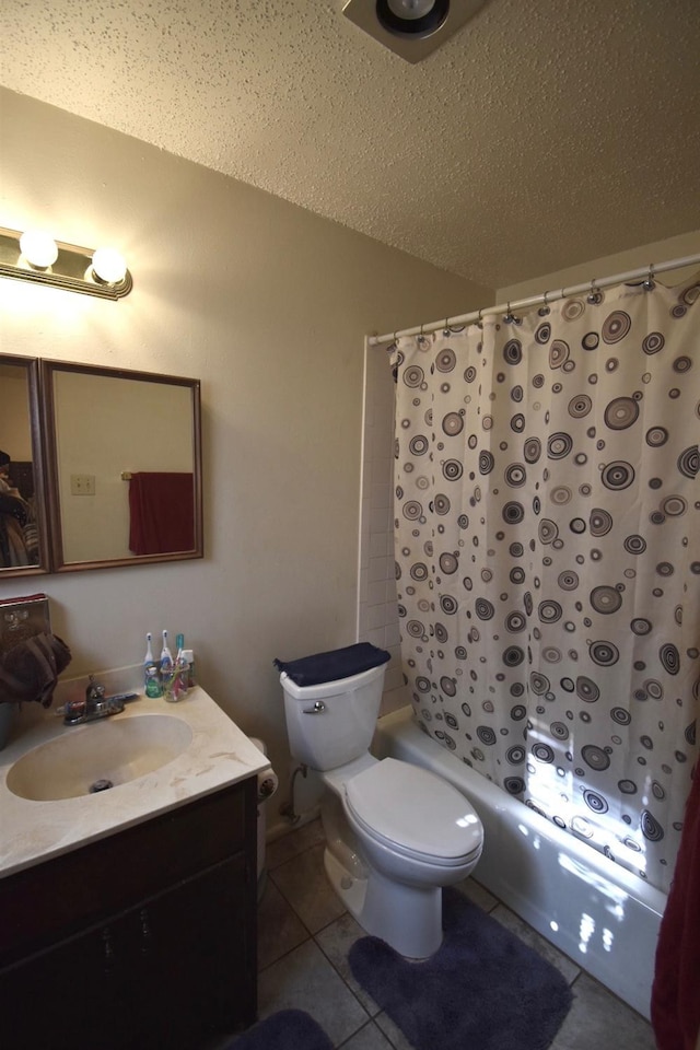 full bathroom with tile patterned flooring, vanity, toilet, shower / bathtub combination with curtain, and a textured ceiling