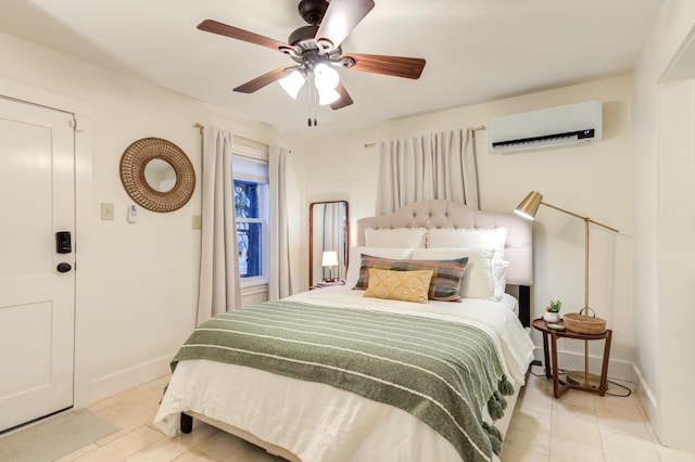 bedroom with light tile patterned floors, baseboards, a wall mounted AC, and ceiling fan