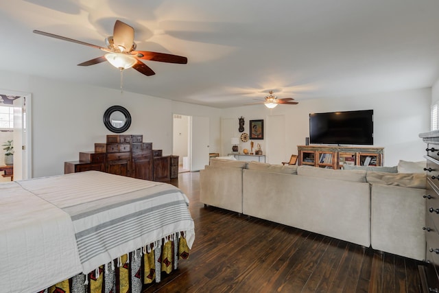 bedroom featuring ceiling fan, multiple windows, and dark wood finished floors