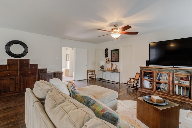 living area with wood finished floors and ceiling fan