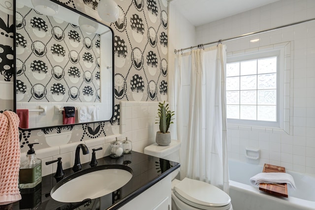 full bathroom featuring tasteful backsplash, vanity, shower / bath combination with curtain, toilet, and tile walls