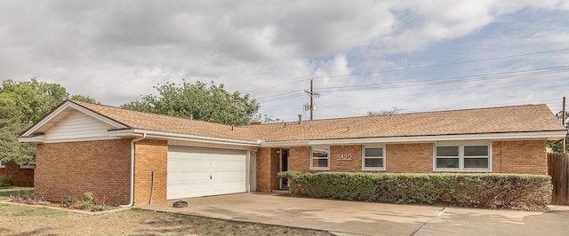 ranch-style home featuring a garage