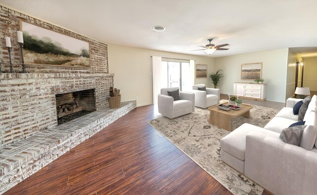 living room with ceiling fan, dark hardwood / wood-style floors, and a brick fireplace