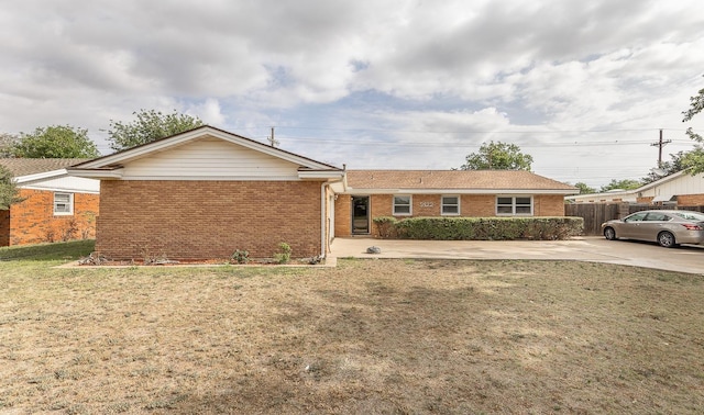 ranch-style house with a front yard