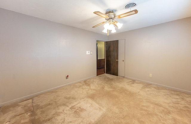 empty room with light carpet and ceiling fan