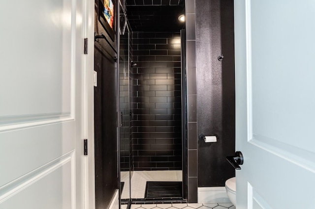 bathroom with walk in shower and toilet