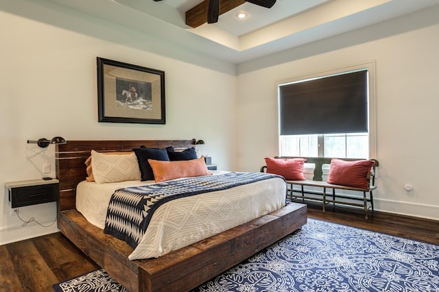 bedroom with hardwood / wood-style flooring, ceiling fan, and beamed ceiling