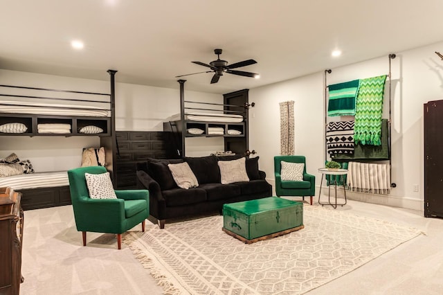 carpeted living room featuring ceiling fan