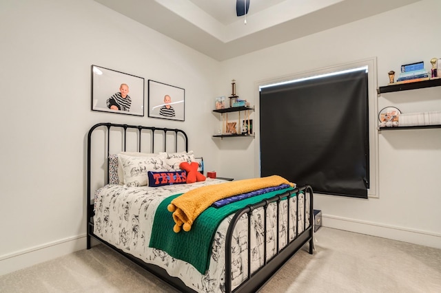 bedroom featuring ceiling fan and carpet