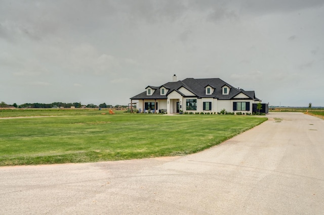 french country home with a front yard