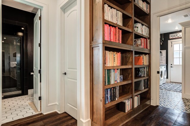 hallway featuring hardwood / wood-style flooring and washer / clothes dryer