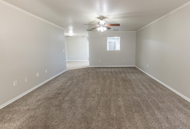 unfurnished room featuring crown molding, carpet floors, and ceiling fan