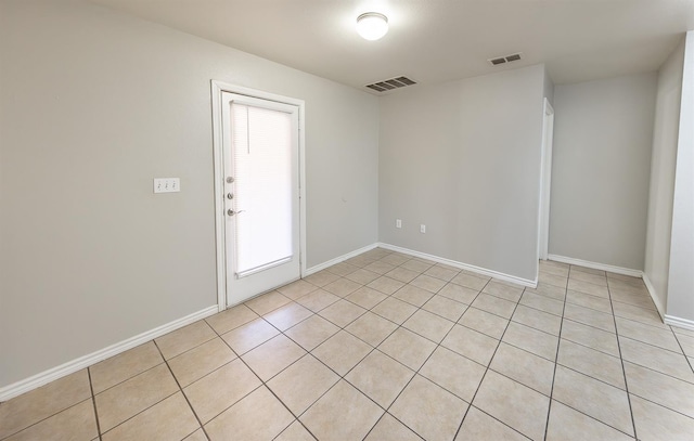 view of tiled spare room