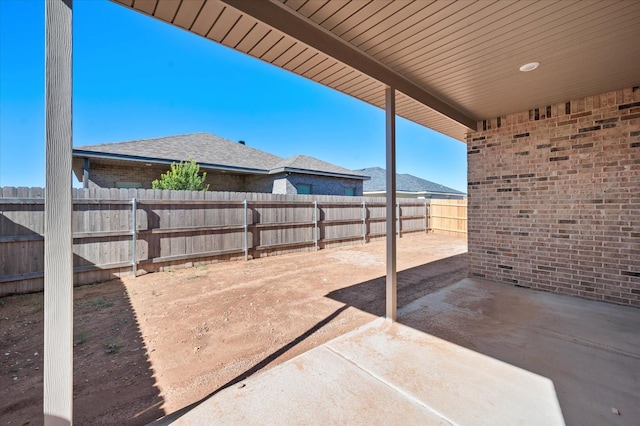 view of patio / terrace featuring a mountain view