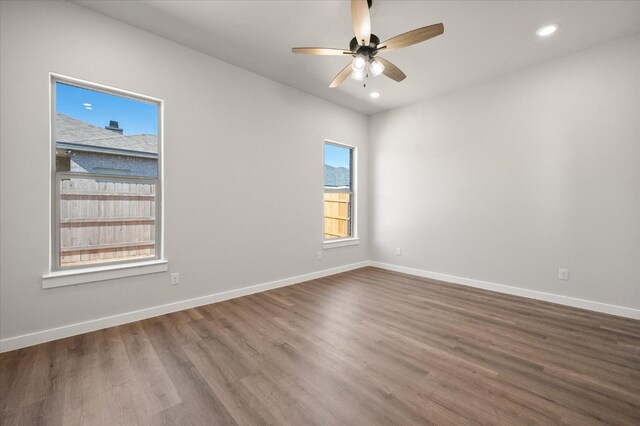 empty room featuring wood-type flooring and ceiling fan