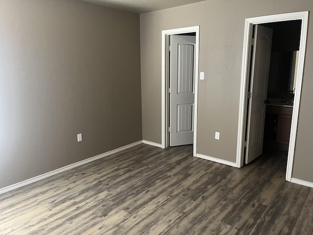 unfurnished bedroom featuring dark hardwood / wood-style floors