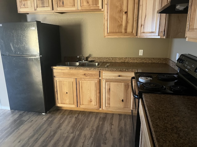 kitchen featuring sink, light brown cabinetry, dark hardwood / wood-style floors, and black appliances