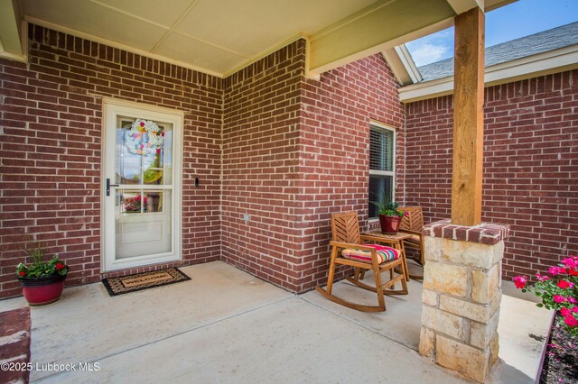 5719 117th St, Lubbock, TX 79424 - property entrance featuring brick siding