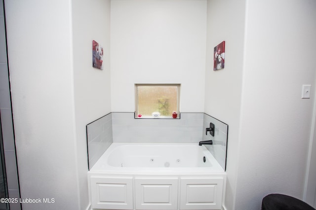 5719 117th St, Lubbock, TX 79424 - full bathroom featuring a tub with jets
