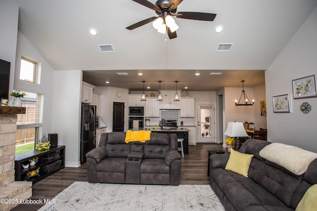 5719 117th St, Lubbock, TX 79424 - living room with high vaulted ceiling, ceiling fan, a chandelier, dark wood-style floors, and recessed lighting