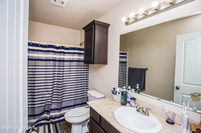 7023 35th St, Lubbock, TX 79407 - bathroom featuring vanity, toilet, and a shower with shower curtain