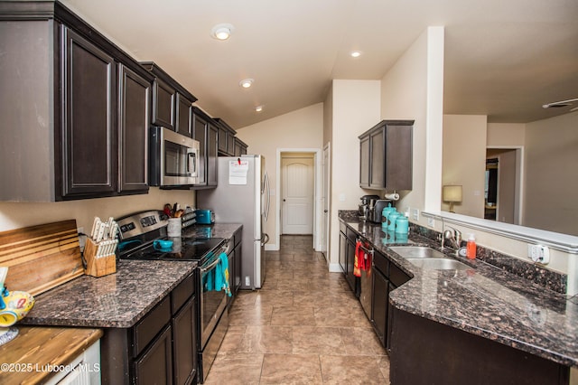7023 35th St, Lubbock, TX 79407 - kitchen featuring a peninsula, a sink, stainless steel appliances, dark brown cabinetry, and lofted ceiling