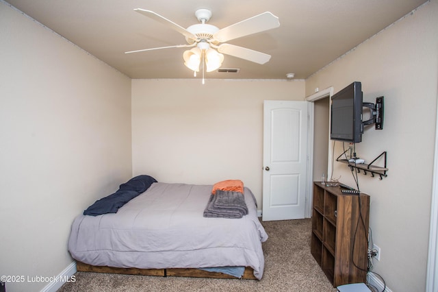 7023 35th St, Lubbock, TX 79407 - carpeted bedroom with a ceiling fan, baseboards, and visible vents