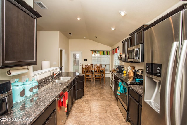 7023 35th St, Lubbock, TX 79407 - kitchen featuring a sink, stainless steel appliances, visible vents, vaulted ceiling, and dark brown cabinets