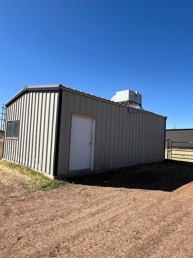 view of outbuilding featuring central AC