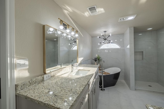 bathroom featuring vanity and shower with separate bathtub