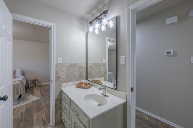 bathroom featuring vanity and hardwood / wood-style floors