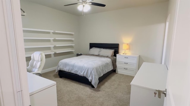 bedroom with light carpet and ceiling fan