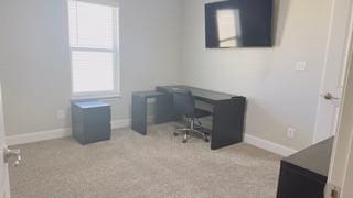 office area with light colored carpet