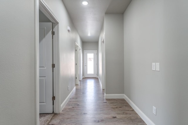 hallway featuring light hardwood / wood-style flooring