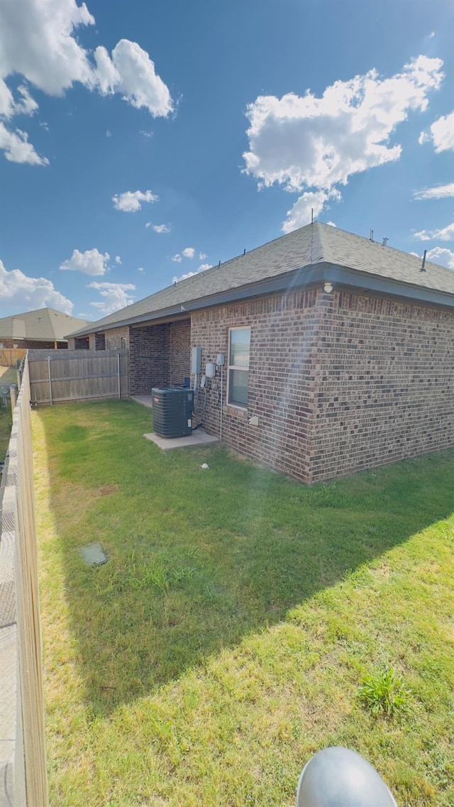 view of yard featuring central AC unit