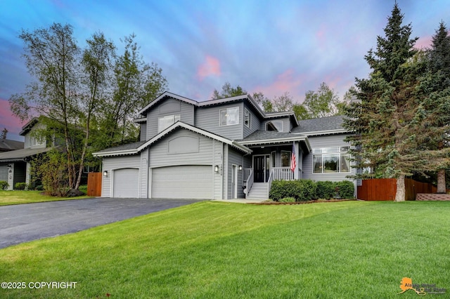 13610 Arboretum St, Anchorage, AK 99516 - view of front of home featuring a garage and asphalt driveway