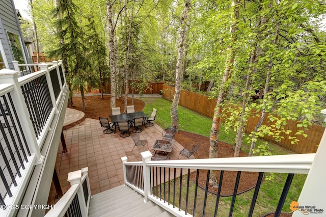 13610 Arboretum St, Anchorage, AK 99516 - wooden deck with outdoor dining space, a patio area, and a fire pit
