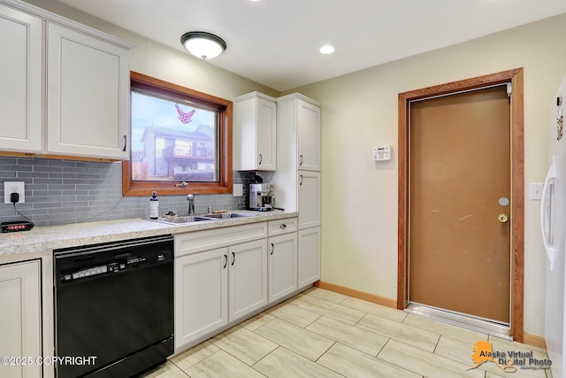 kitchen with white cabinetry, a sink, light countertops, dishwasher, and tasteful backsplash