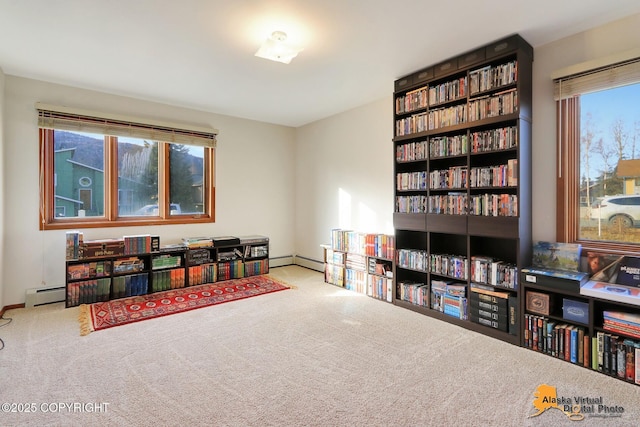 rec room with baseboards, a baseboard heating unit, and carpet