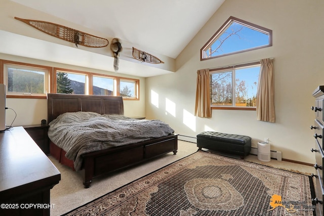 bedroom with baseboards, a baseboard heating unit, multiple windows, and carpet floors