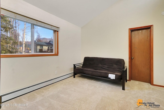 sitting room with a baseboard radiator, lofted ceiling, and carpet floors