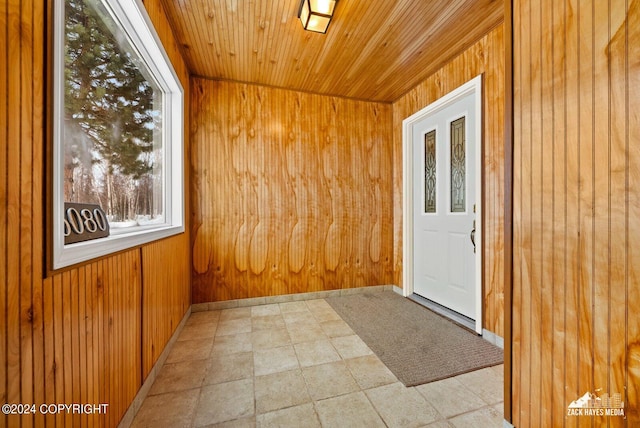 unfurnished sunroom with wooden ceiling