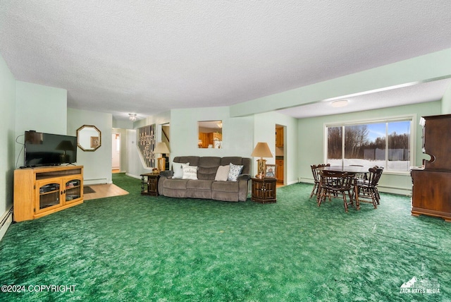 living room featuring a baseboard radiator, dark colored carpet, and a textured ceiling