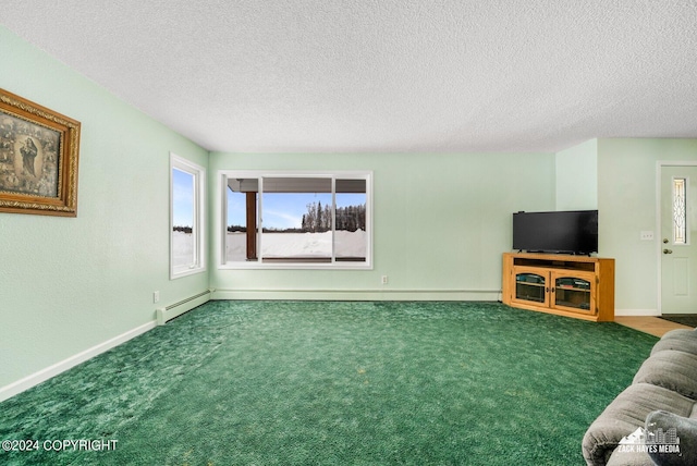 unfurnished living room featuring a textured ceiling, dark carpet, and baseboard heating