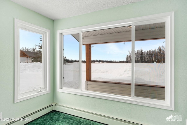 unfurnished sunroom featuring baseboard heating