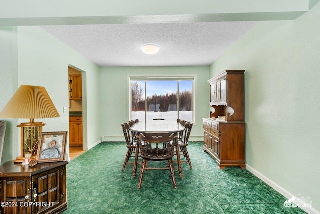 dining area with dark colored carpet, a baseboard radiator, and a textured ceiling